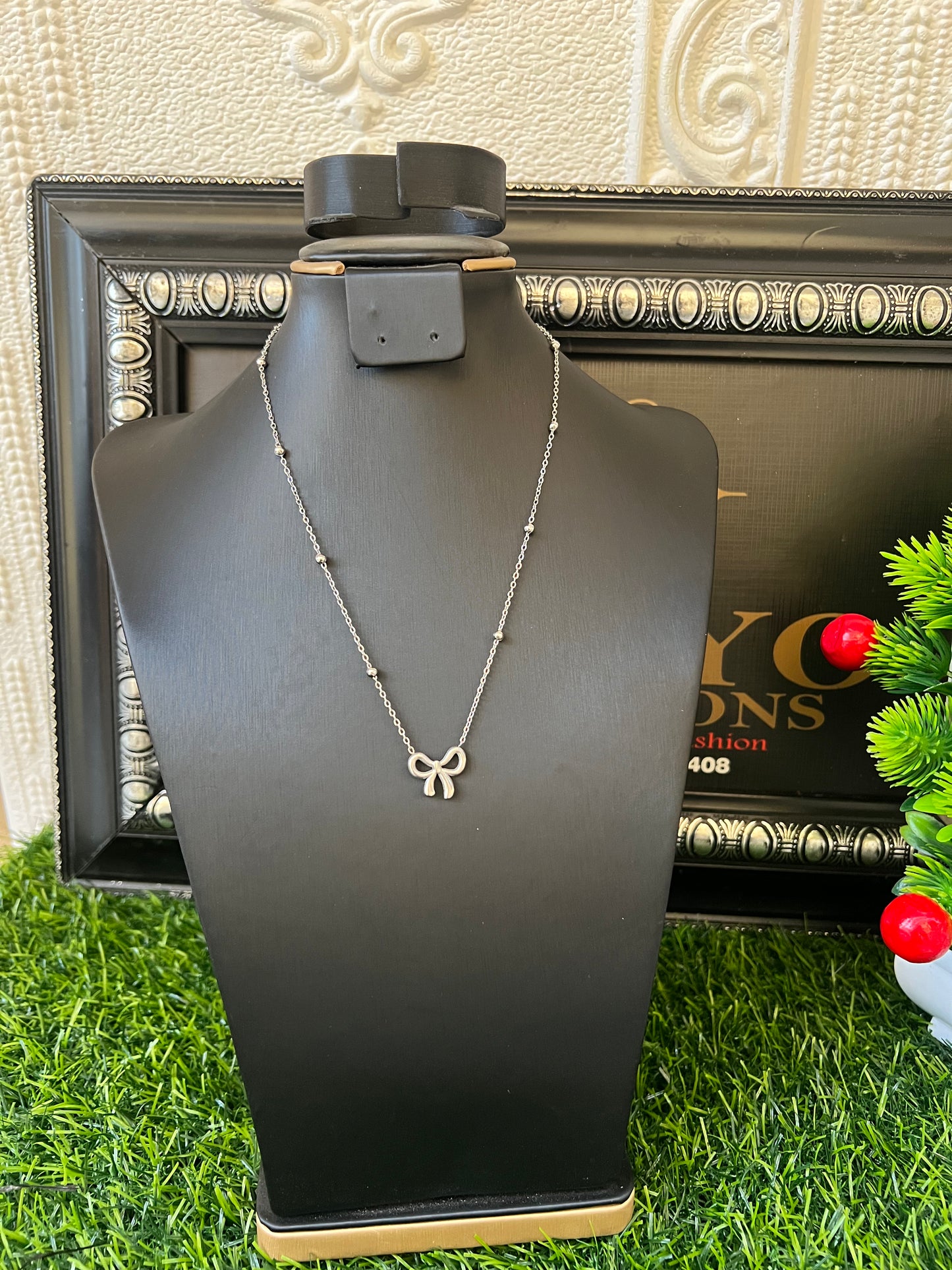 Silver bow tie necklace