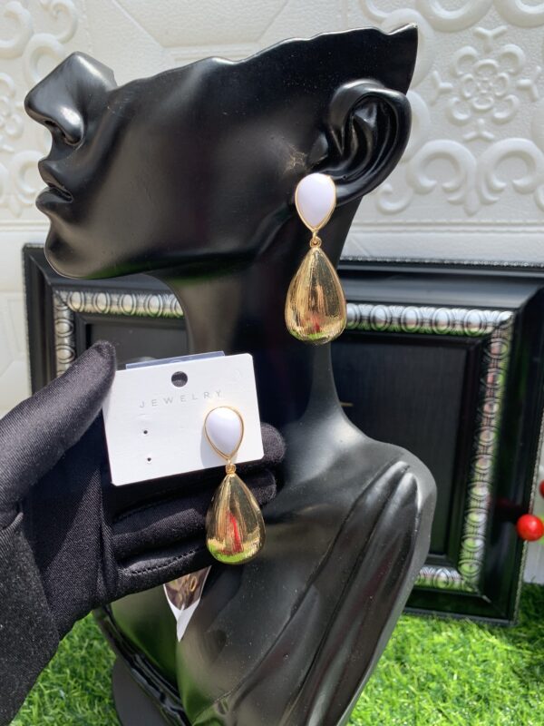 Gold and white earrings