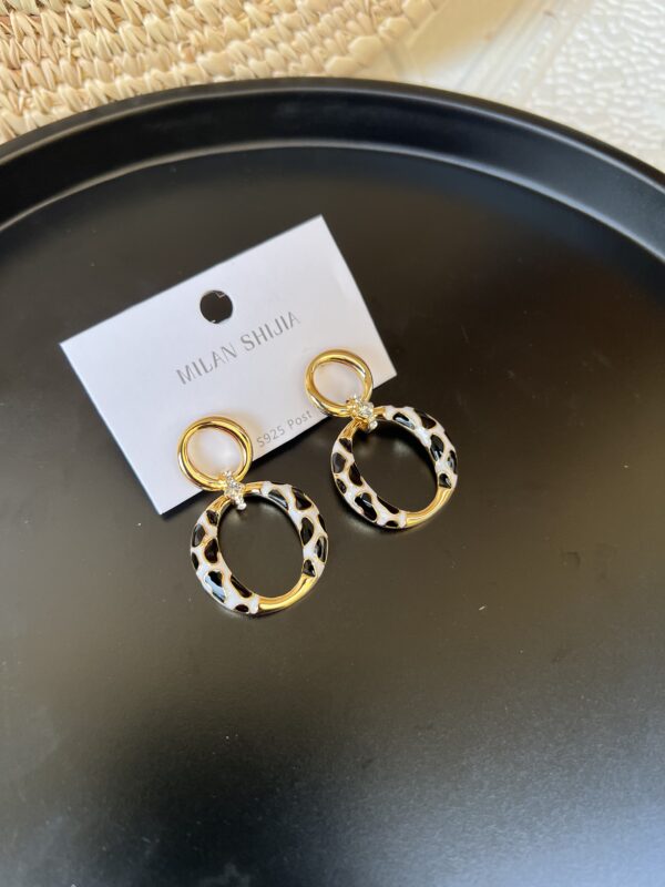 Akunne gold/black and white earrings