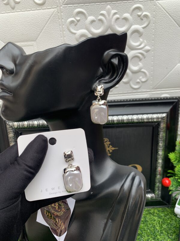 Silver and white earrings