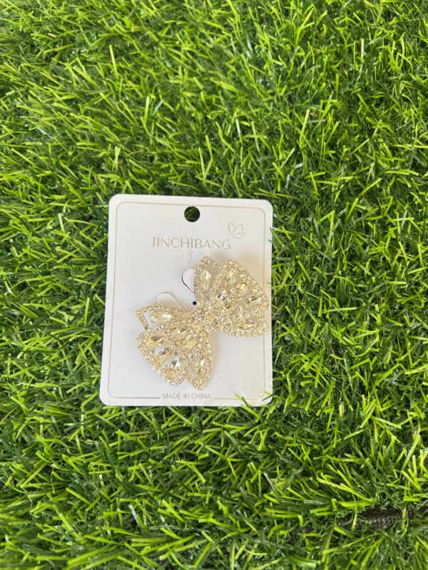 Gold stoned bow brooch
