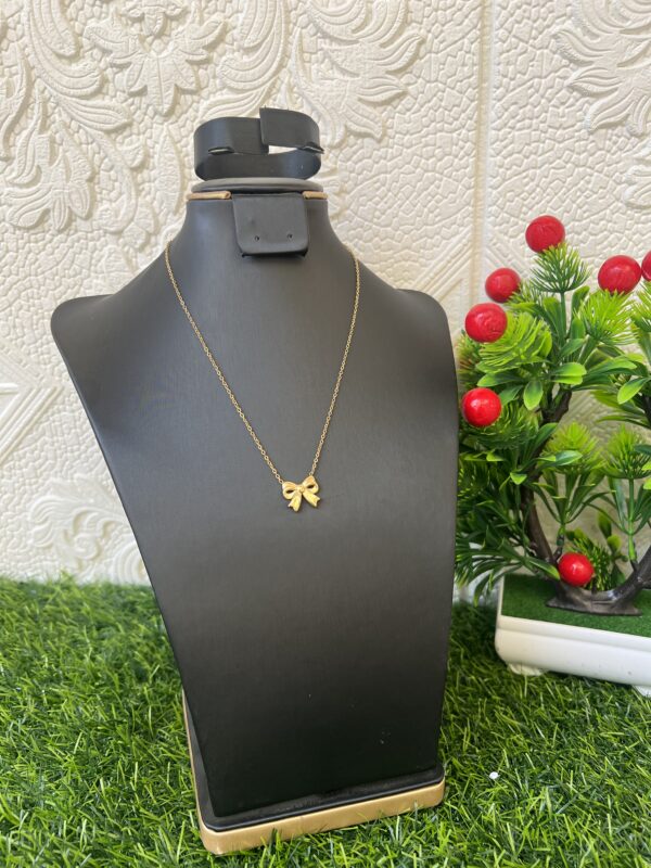 Bow tie gold necklace