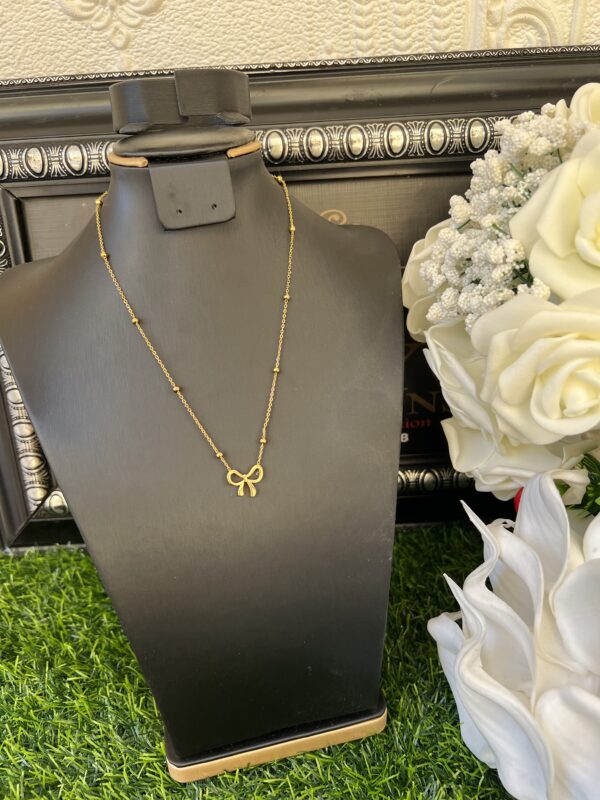 Gold bow tie candy necklace