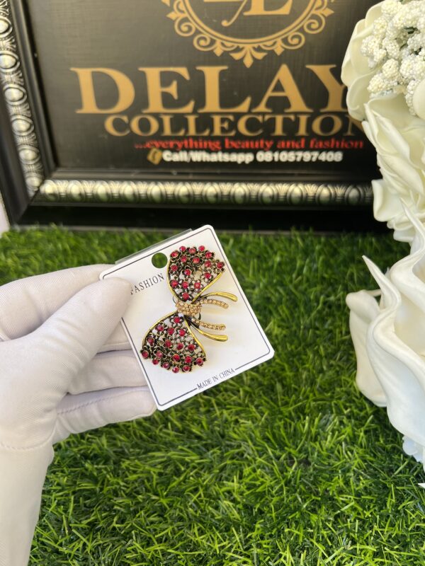 Red stoned bow tie brooch