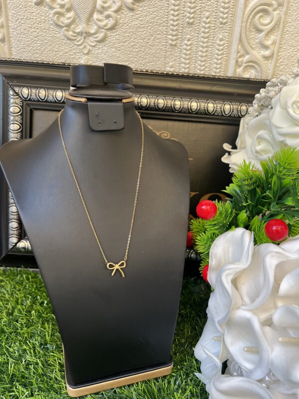 Gold bow tie necklace