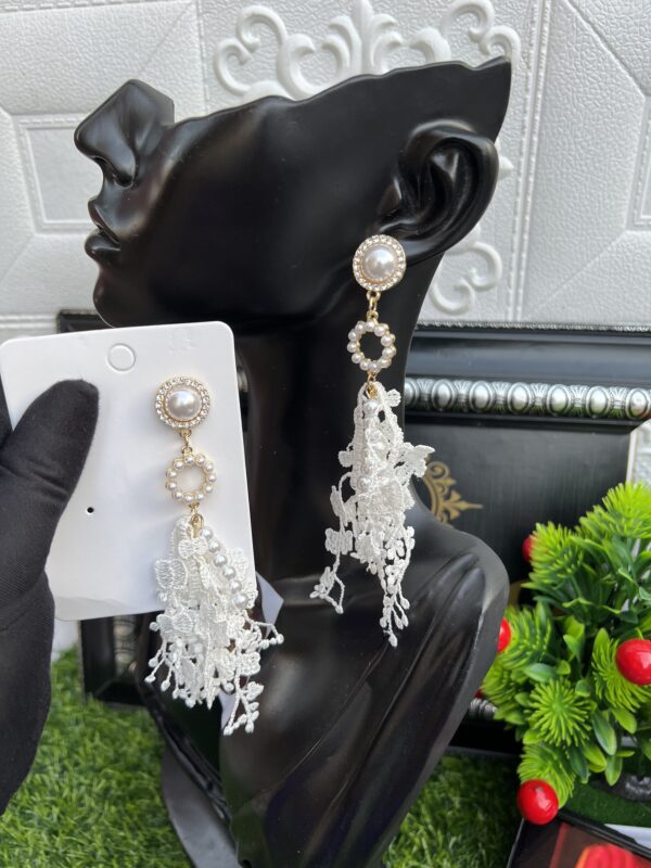 White dropping earrings