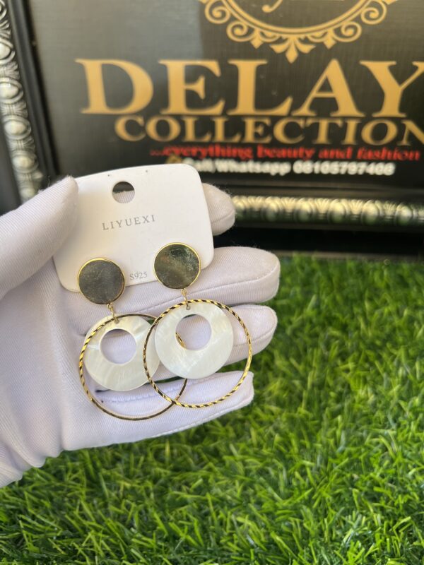 Gold and cream earrings