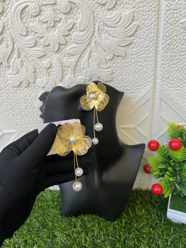 Gold statement earrings with pearl