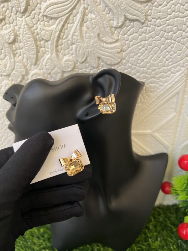 Gold stoned bow tie earrings