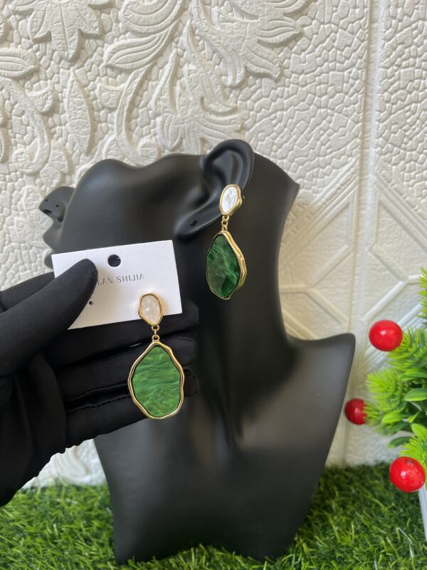 Green statement earrings