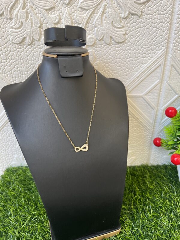 Gold bow tie stoned earrings