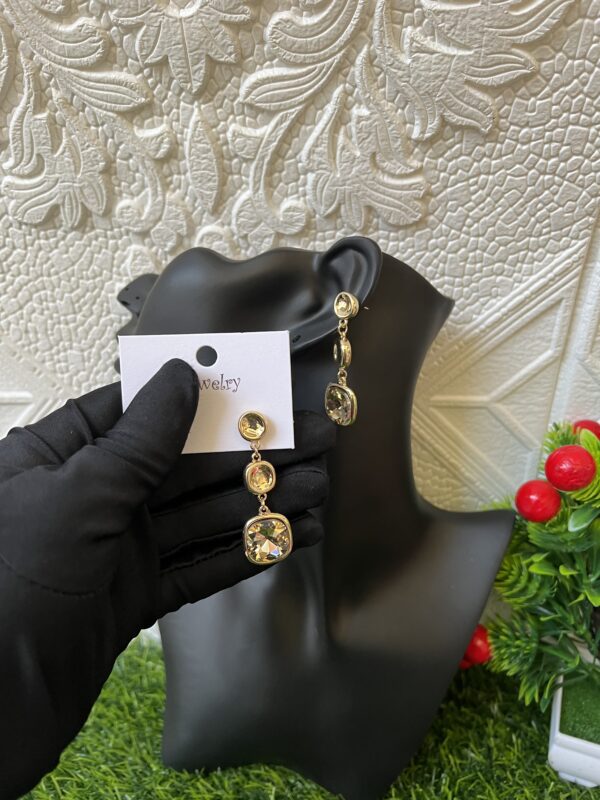 Gold stoned dropping earrings