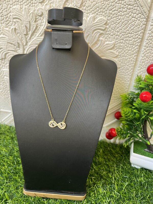 Gold stoned infinity necklace