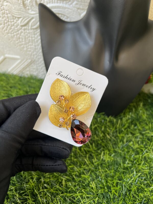 Gold/purple brooch