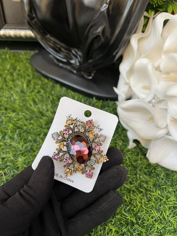 Purple stoned brooch