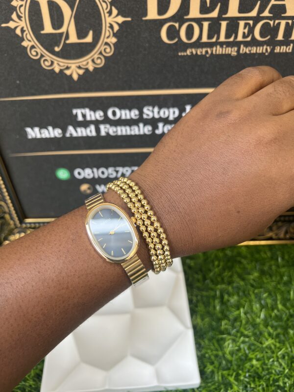 Sleek gold watch and bracelet set