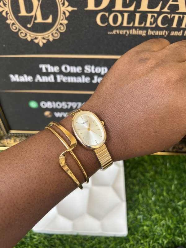Sleek gold and white watch and bracelet set
