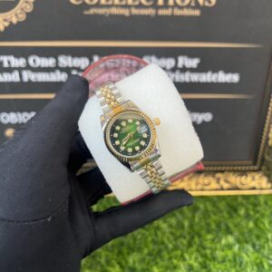gold/silver mixed wristwatch with green face