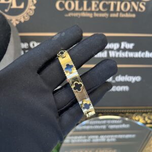 gold and black vca bangle