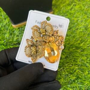 Barbie gold brooch